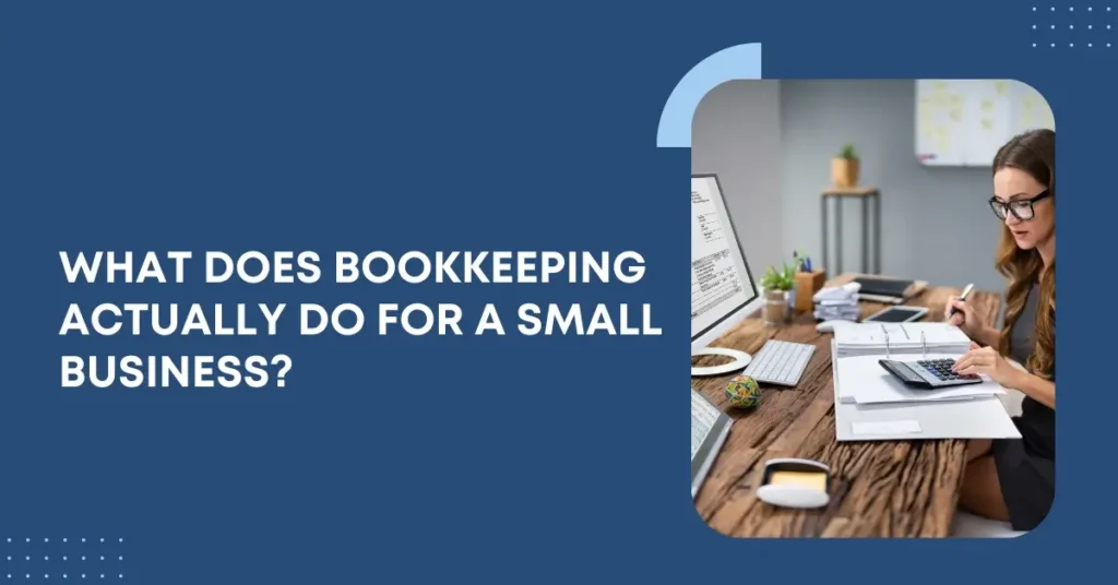 Small business owner working at a desk reviewing financial documents to explain what bookkeeping does for a small business